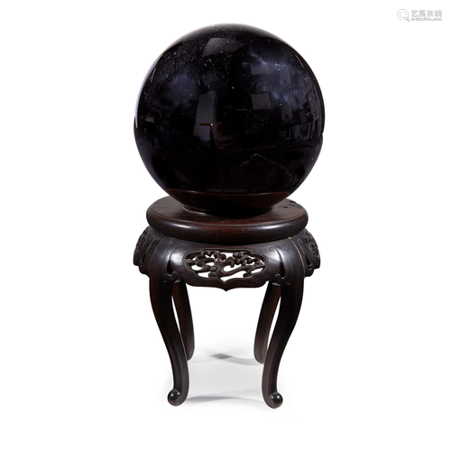 A Japanese black obsidian sphere with car…