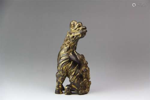 A Chinese Carved Rosewood Beast Ornament