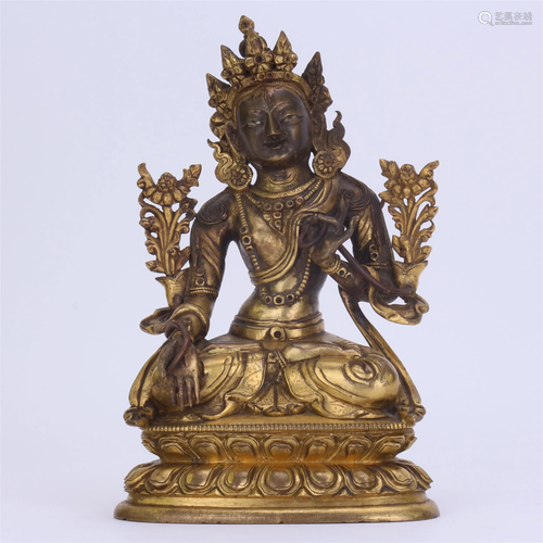 A CHINESE GILT BRONZE FIGURE OF WHI…