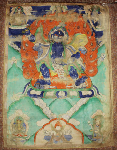 A Tibetan thangka, Qing dynasty, painted with Mahakala standing on a lotus throne with flame