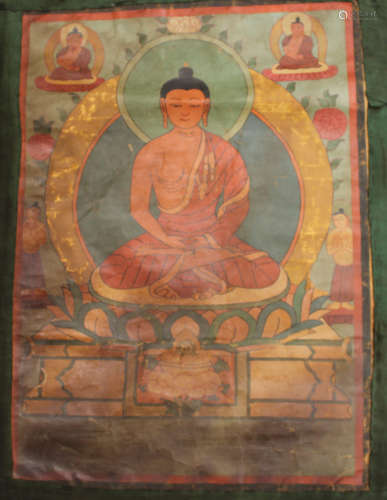 A Tibetan thangka, late Qing dynasty, painted and gilt with a central seated Buddha surrounded by