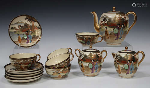 A Japanese Satsuma earthenware part tea service, 20th century, each piece polychrome painted and