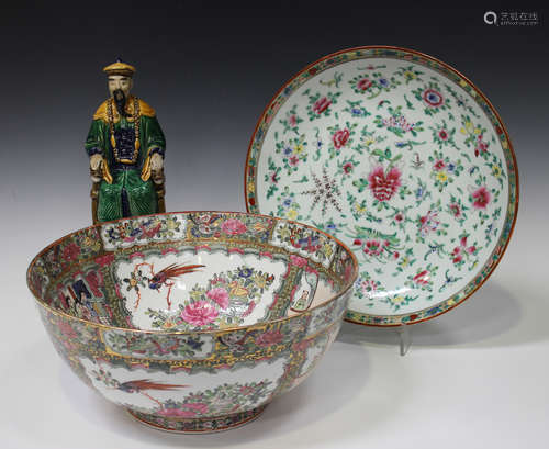 A Chinese Canton style famille rose punchbowl, late 20th century, painted and printed with panels of