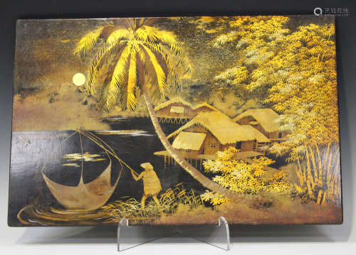A Vietnamese lacquer painting, mid 20th century, depicting a black and gilt moonlit scene of a