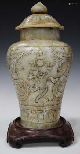 A Chinese hardstone jar and cover, 20th century, the baluster body carved in low relief with