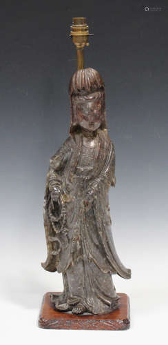 A Chinese carved soapstone figure of Guanyin, early 20th century, modelled in a standing pose, the