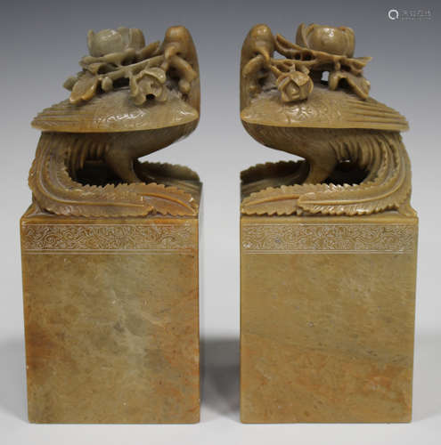 A pair of Chinese carved soapstone figures of fenghuang (phoenix), early 20th century, each