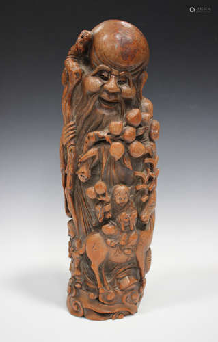 A Chinese carved bamboo figure of Shoulau, early 20th century, finely carved in relief, standing