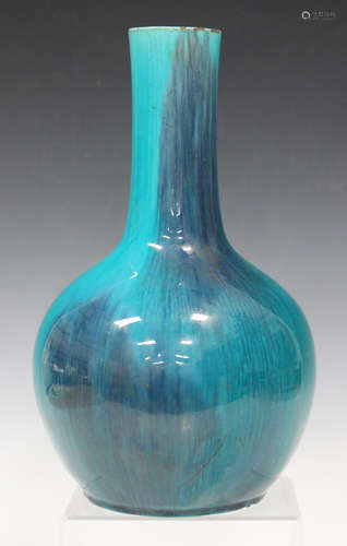 A Chinese turquoise glazed pottery bottle vase, late Qing dynasty, covered in a streaky glaze,