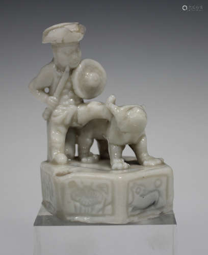 A Chinese blanc-de-Chine porcelain figural toy whistle, Kangxi period, modelled as a Dutchman