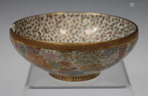 A Japanese Satsuma earthenware circular bowl by Kinkozan, Meiji period, the interior finely