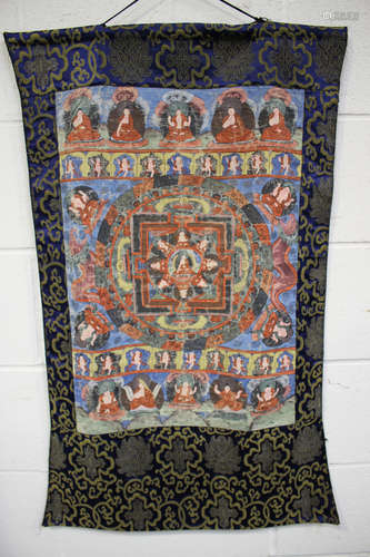 A Tibetan thangka, probably late Qing dynasty, painted with the Wheel of Law and central Buddha