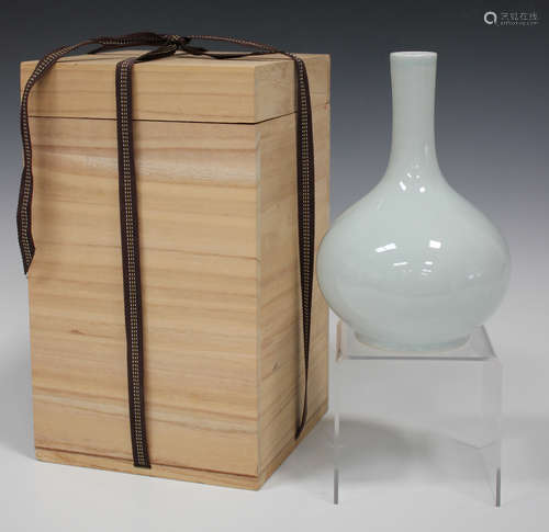 A Korean white glazed porcelain bottle vase by Ahn Dong-Oh, mid to late 20th century, blue printed