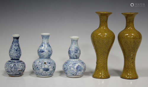 A pair of Chinese mustard yellow crackle glazed pottery vases, probably late Qing dynasty, each of