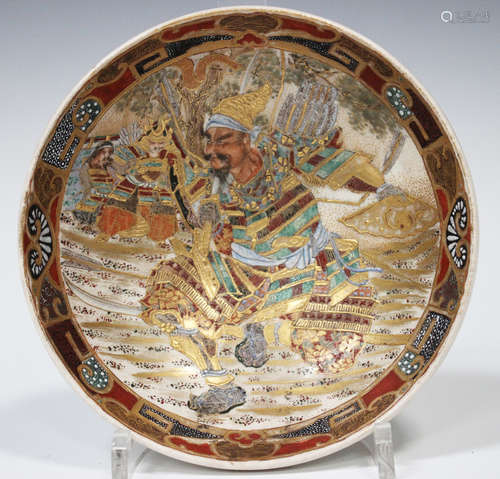 A Japanese Satsuma earthenware bowl, Meiji period, of shallow circular form, the interior painted