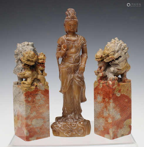 A Chinese carved brown soapstone figure of Guanyin, probably 20th century, modelled standing on a