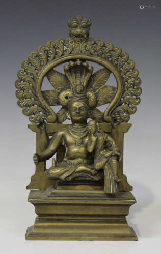 A South Indian sectional bronze figure group, late 19th century, modelled as a four armed moustached