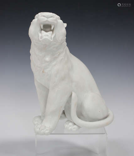 A Japanese Hirado biscuit porcelain figure of a growling tiger, Meiji period, finely modelled in a