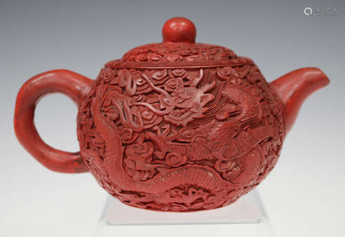 A rare Chinese cinnabar lacquered Yixing stoneware teapot and cover, late Qing dynasty, the