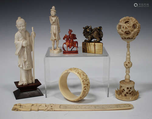 A small group of Chinese ivory carvings, late 19th/early 20th century, including a Canton paperknife