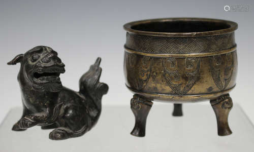 A Chinese brown patinated bronze censer, Qing dynasty, the cylindrical body with incised wave band