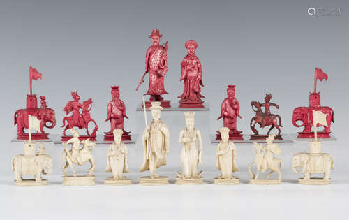 A Chinese Canton carved export ivory part chess set, early 19th century, the Chinese side stained