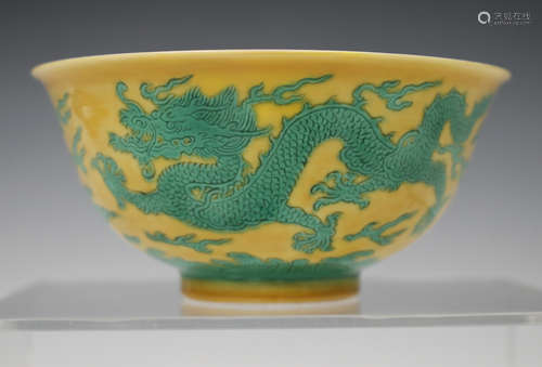 A Chinese yellow and green enamelled porcelain 'dragon' bowl, mark of Qianlong and possibly of the