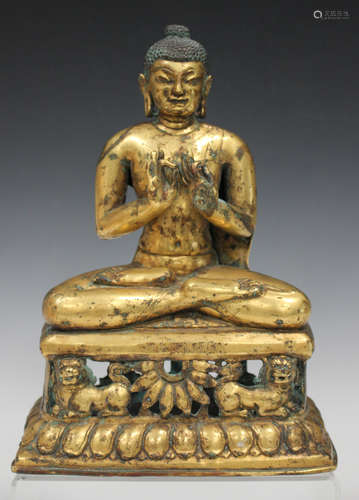 A Chinese gilt bronze Buddha, Ming style but probably 19th/20th century, modelled seated in