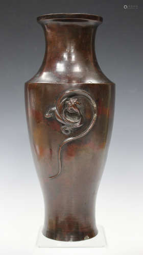 A Chinese brown patinated bronze vase, Qing dynasty, the shouldered baluster body applied with a