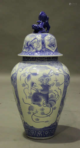 A Japanese Arita blue and white porcelain jar and domed cover with Buddhistic lion finial, Meiji