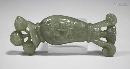 A Mughal style pale celadon jade dagger handle, probably 20th century, carved and pierced in the