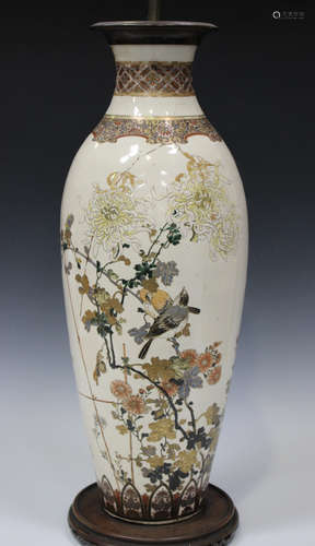 A Japanese Satsuma earthenware vase by Niimura, Meiji period, the elongated ovoid body painted and