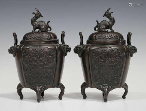 A pair of Chinese brown patinated bronze censers and covers, early 20th century, each lobed ovoid