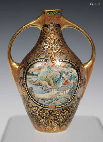 A Japanese Satsuma earthenware two-handled vase, Meiji period, the black ground baluster body and