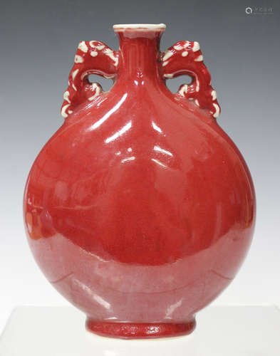 A Chinese sang-de-boeuf glazed porcelain moonflask, 20th century, the flattened circular body with