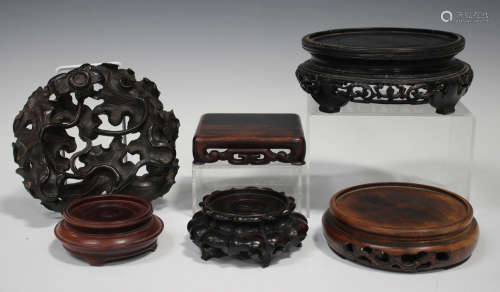 A group of six Chinese hardwood stands, late Qing dynasty and later, including a carved and