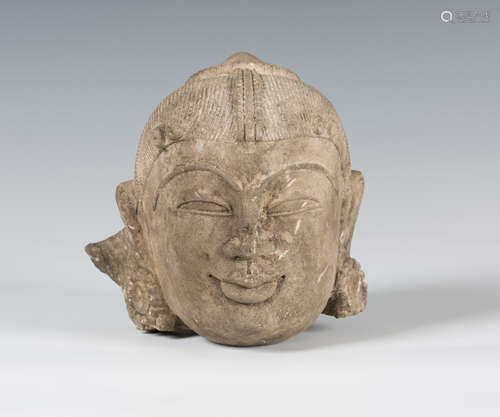 An Indian carved sandstone head of a Bodhisattva, possibly 5th/6th century, with finely carved