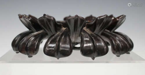 A Chinese hardwood stand, probably late Qing dynasty, finely carved in the form of a lotus pod