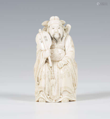 A Japanese carved ivory okimono figure, Meiji/Taisho period, finely modelled as a Chinese