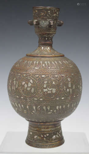 A Middle Eastern Islamic copper bottle vase/hookah base, of globular form with spreading foot, the