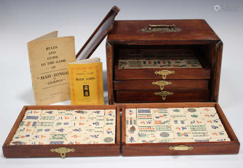 A Chinese Mahjong set, early 20th century, with bone and bamboo tiles, contained within a five