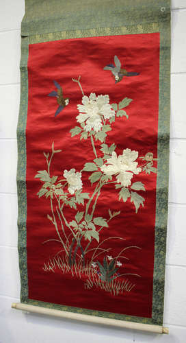 A pair of Japanese silk embroidered hanging scrolls, early 20th century, each worked in coloured