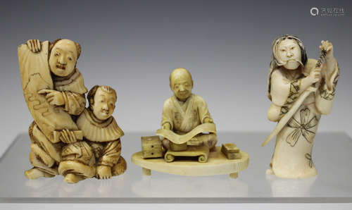 A Japanese carved ivory okimono figure of a scholar, Meiji period, modelled seated on an oval