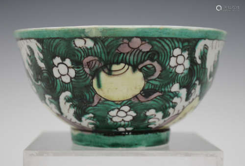 A Chinese famille verte enamelled and blue and white biscuit porcelain bowl, Kangxi period, the