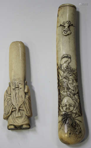 A Japanese staghorn kiseruzutsu (pipe case) Edo/Meiji period, carved in low relief with four Gods of