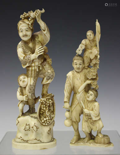 A Japanese carved ivory okimono figure group, Meiji period, modelled as a father and two boys,