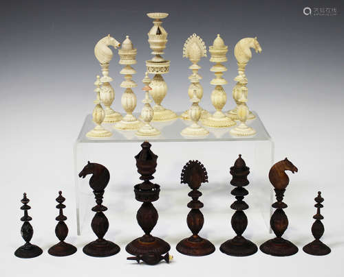 An Indian export ivory part chess set, 19th century, one side stained brown, the other left natural,