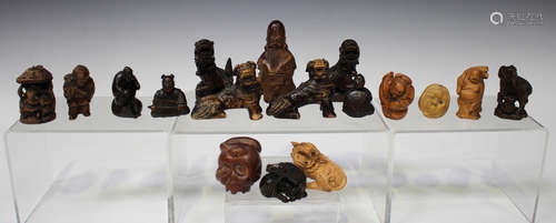 A collection of Japanese hardwood and boxwood netsuke, mostly 20th century, including figures and