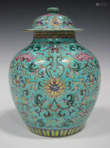 A Chinese famille rose enamelled turquoise ground porcelain jar and cover, 19th century, the stout