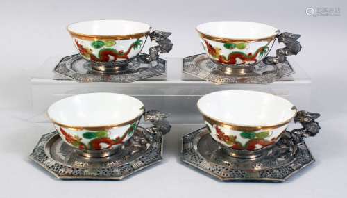 A SET OF FOUR 20TH CENTURY CHINESE FAMILLE ROSE PORCELAIN AND SILVER MOUNTED CUPS & SAUCERS, the